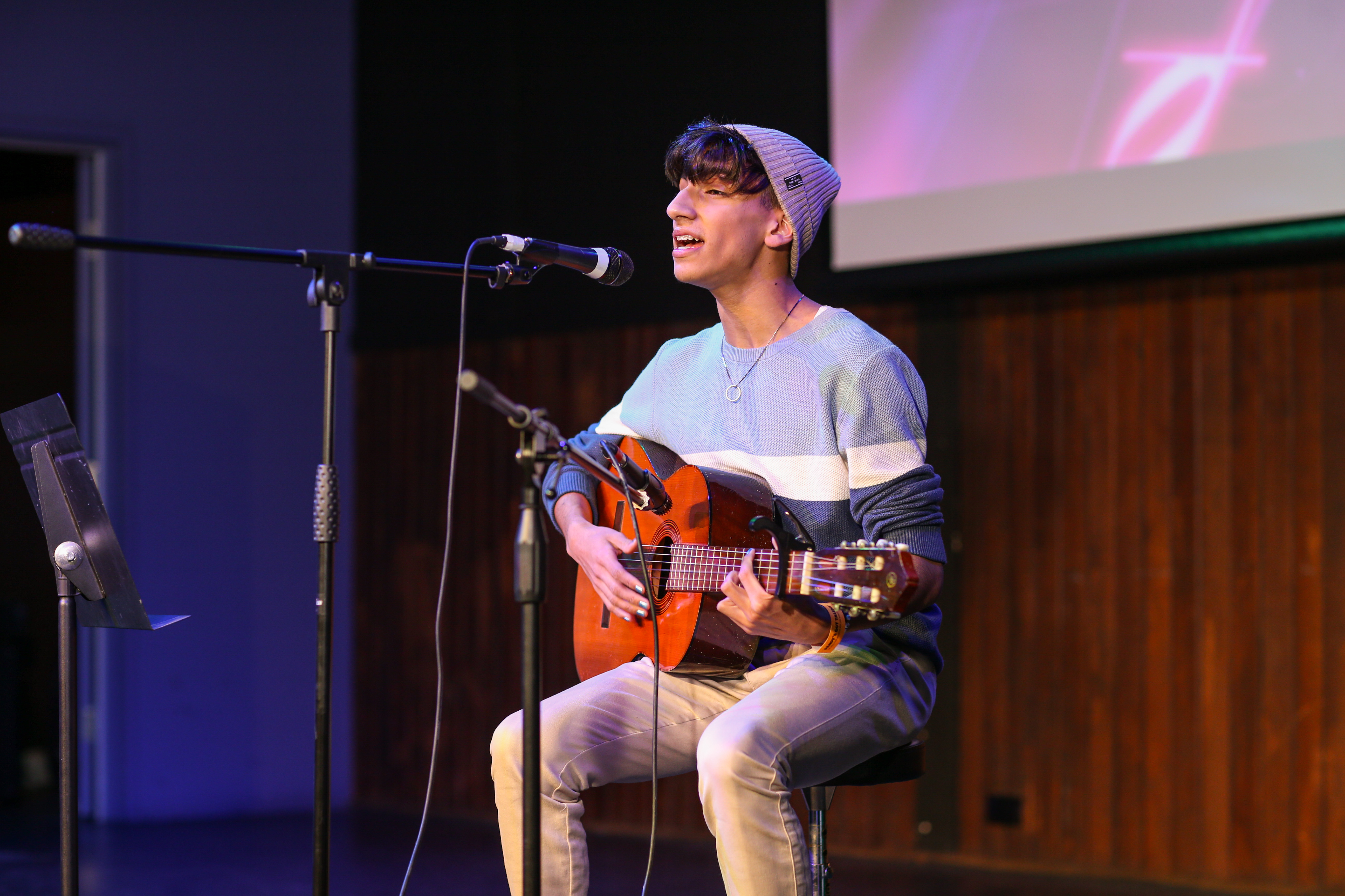 young person with guitar