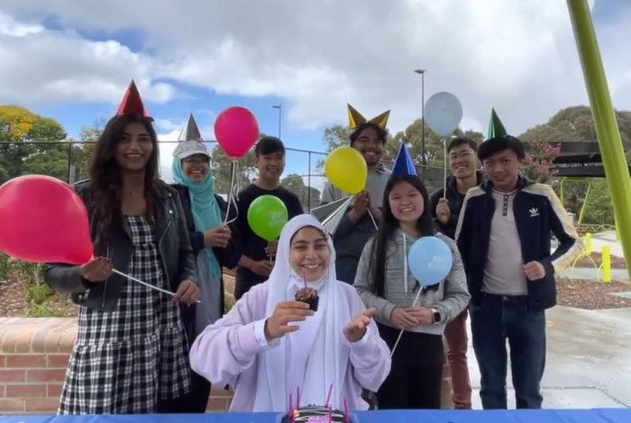 Group of young people having a COVID Safe birthday party