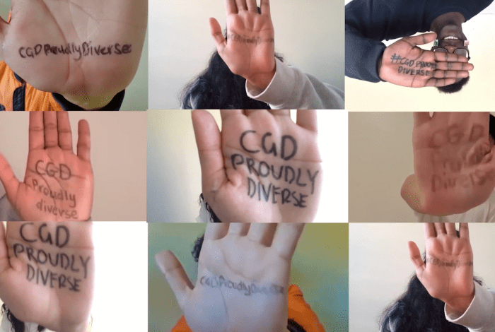 Young people raising their hands, with 'CGD Proudly Diverse' written on their palms