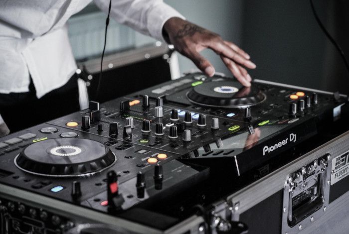 someone's hand on a DJ set