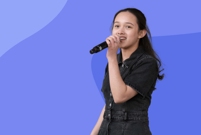 young person singing with a purple background