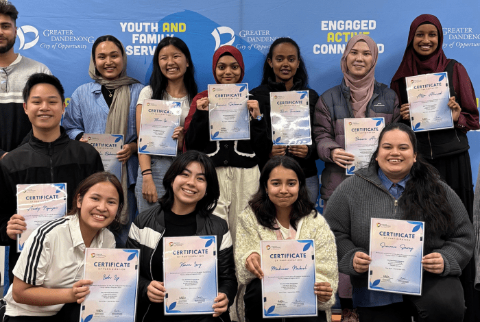 Young leaders posing with certificates