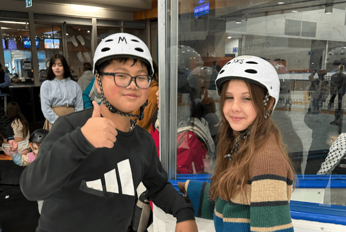 young people at ice skating activity