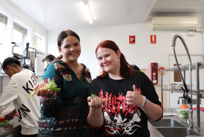 two young people cooking