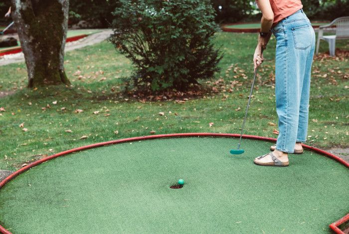 young person playing mnigolf
