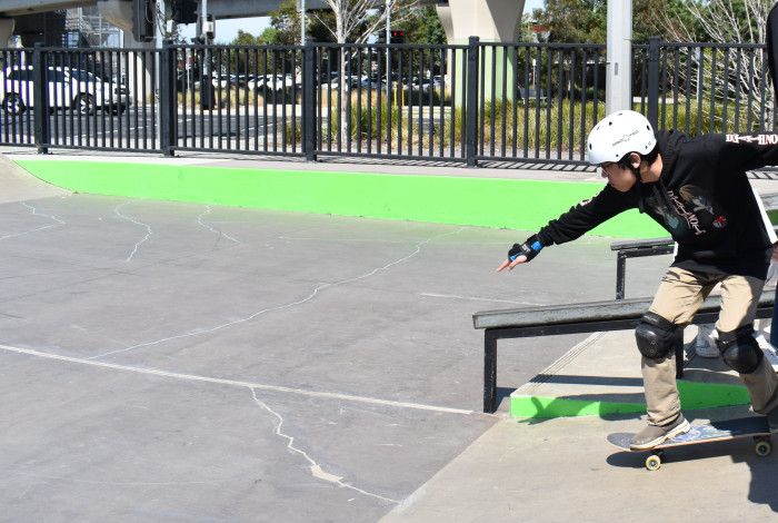 young person skating down ramp