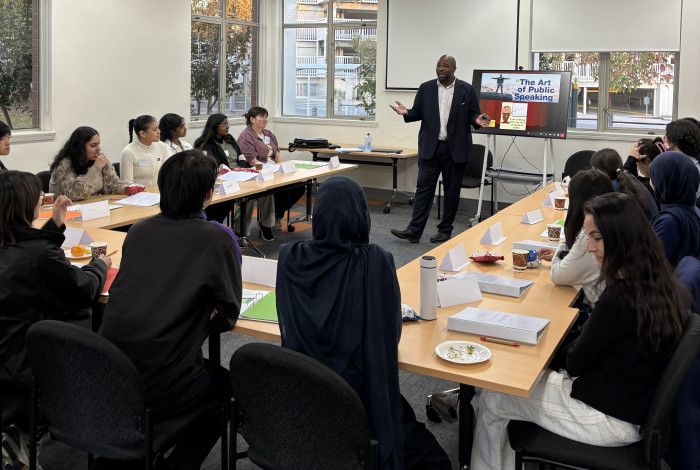 Image of young people listening to facilitator
