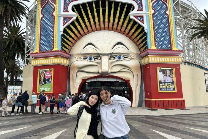 young people standing at luna park entrance