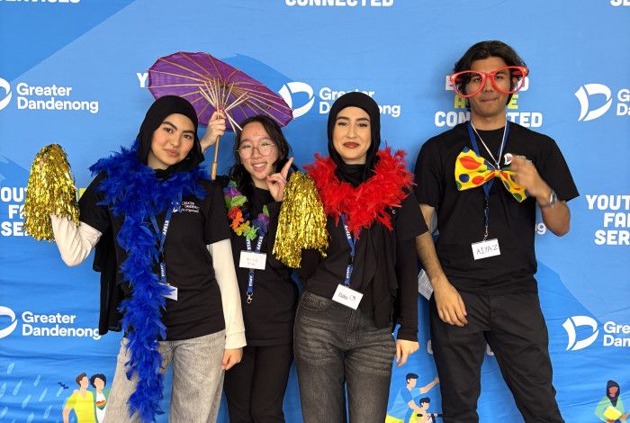 Young people standing and smiling