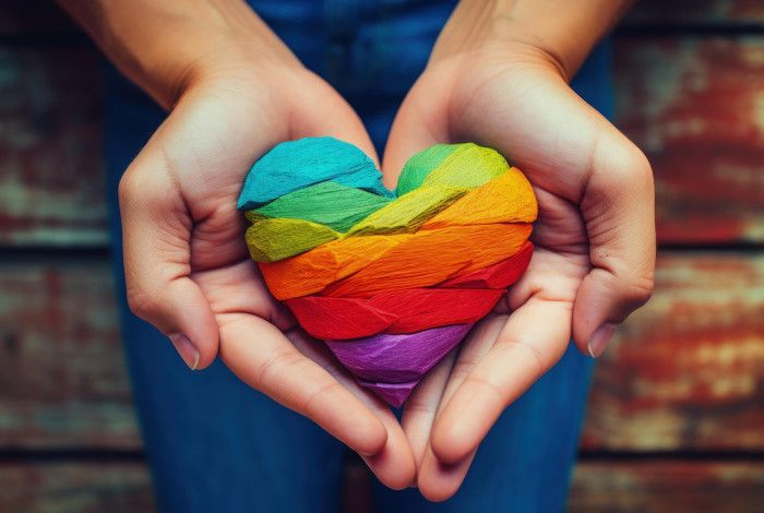 Someone holding a wooden love heart