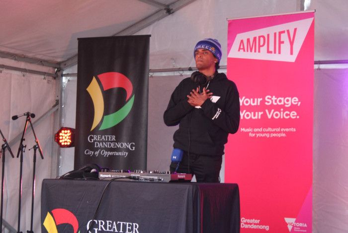young person on stage djing