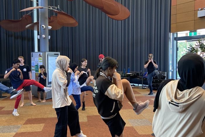 young people doing self defence class
