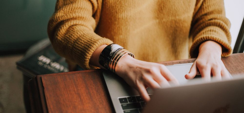 Person typing on laptop