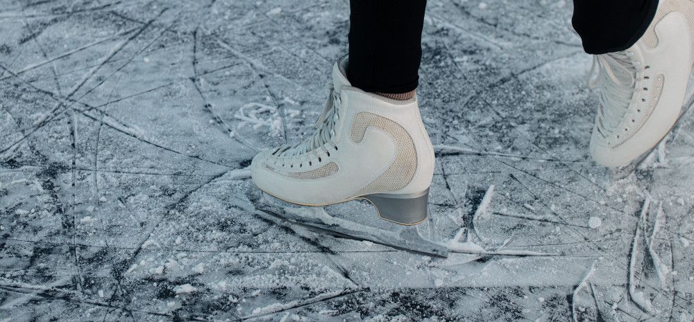 Legs of a female playing ice skating