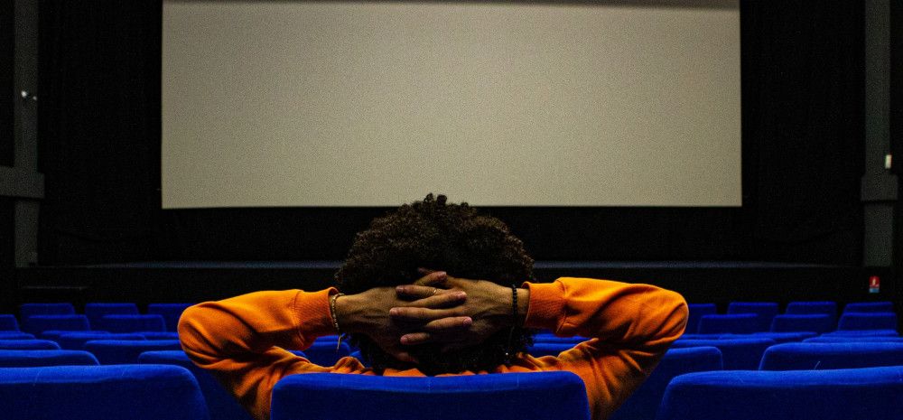 a young person looking at the cinema screen