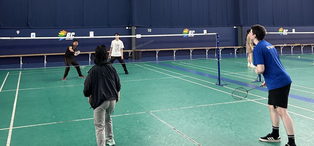 young people playing badminton