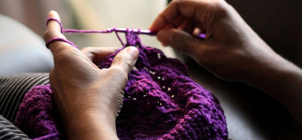 person doing crochet