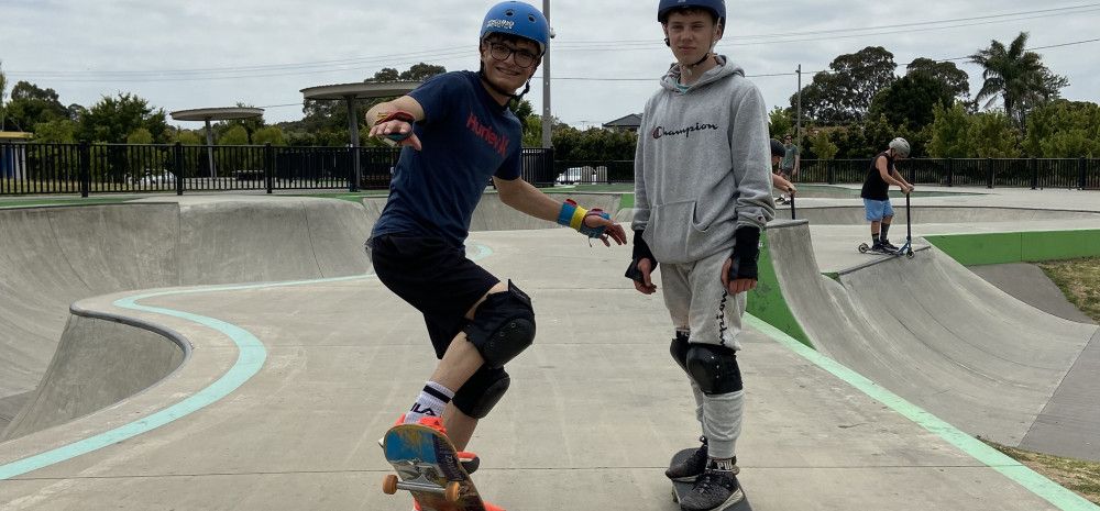 Two young people on skateboards