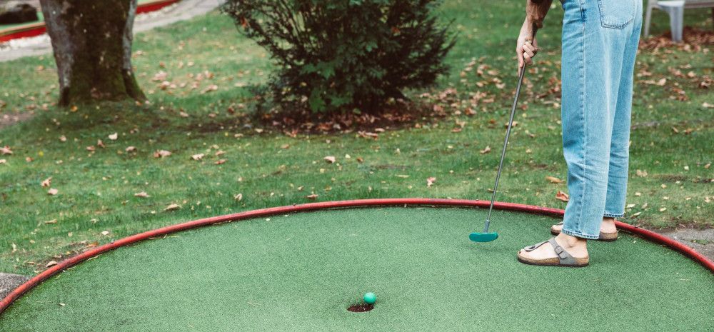 young person playing mnigolf
