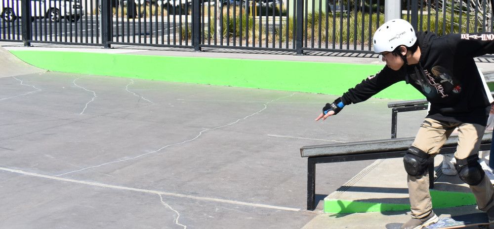 young person skating down ramp