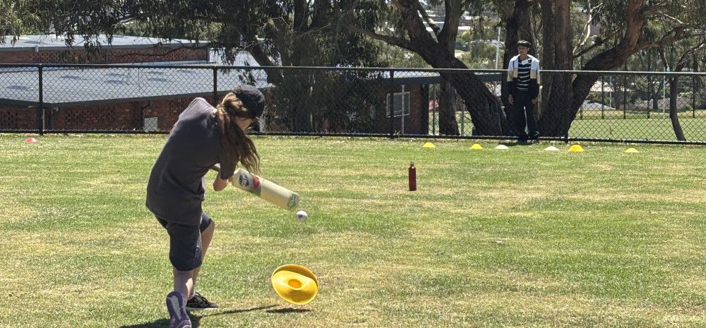 Young person playing cricket