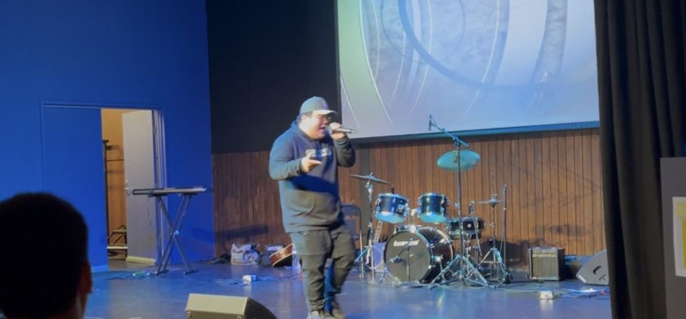 Yong person rapping on stage