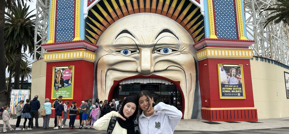 young people standing at luna park entrance