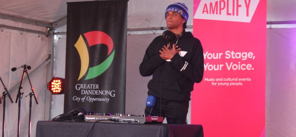 young person on stage djing