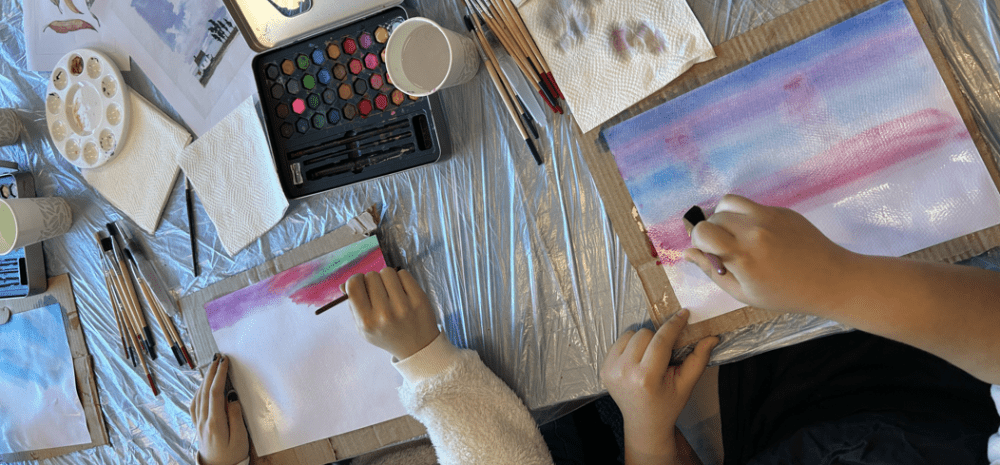 two young people painting