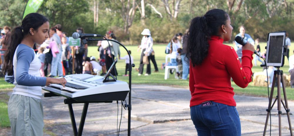 A keyboard player and singer at an Open Mic performance