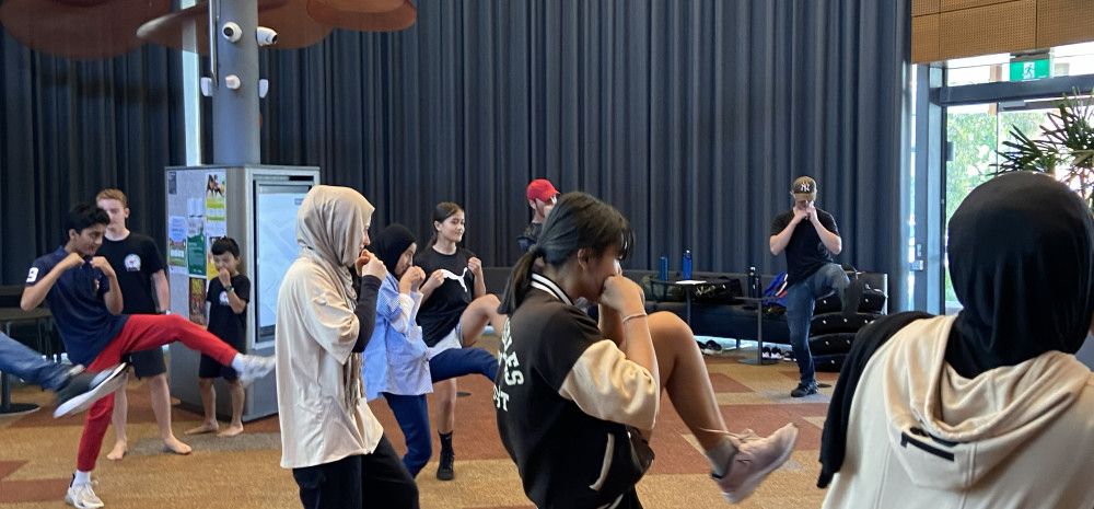 young people doing self defence class