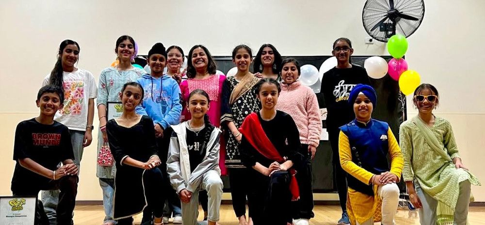 group of young people smiling in dance studio