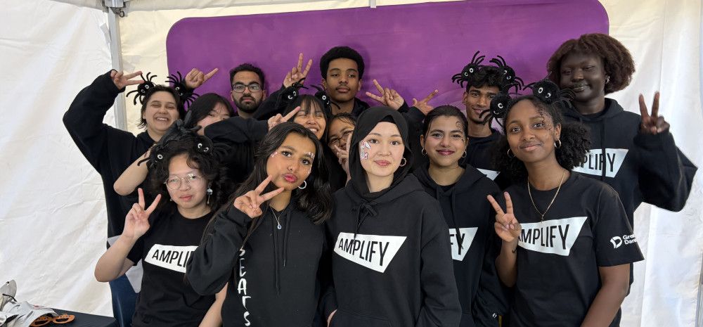 Image of a group of young people posing together for a photo.