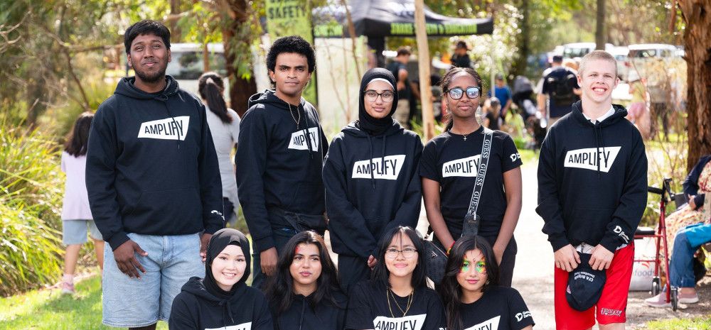 A group of young people smiling