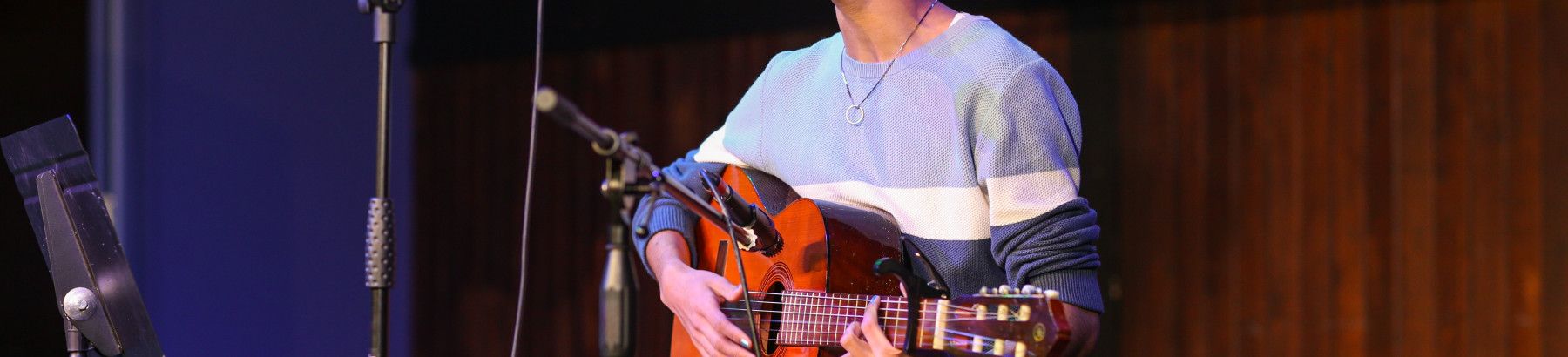 young person with guitar