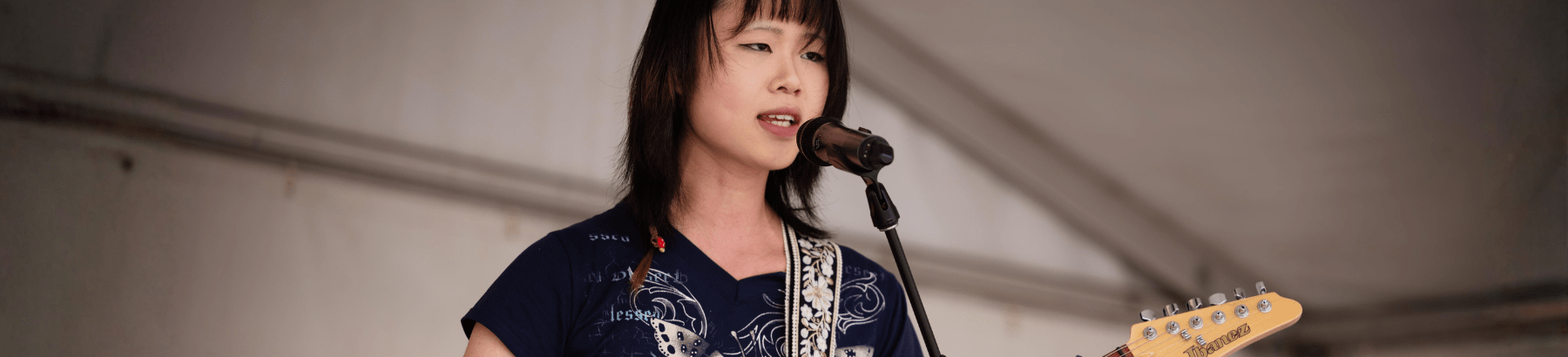 young person singing on the stage