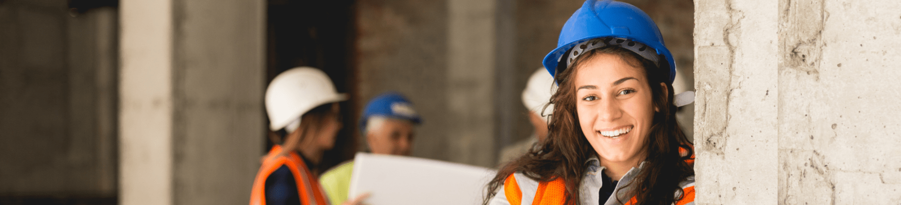young woman with a hard hat and high vis