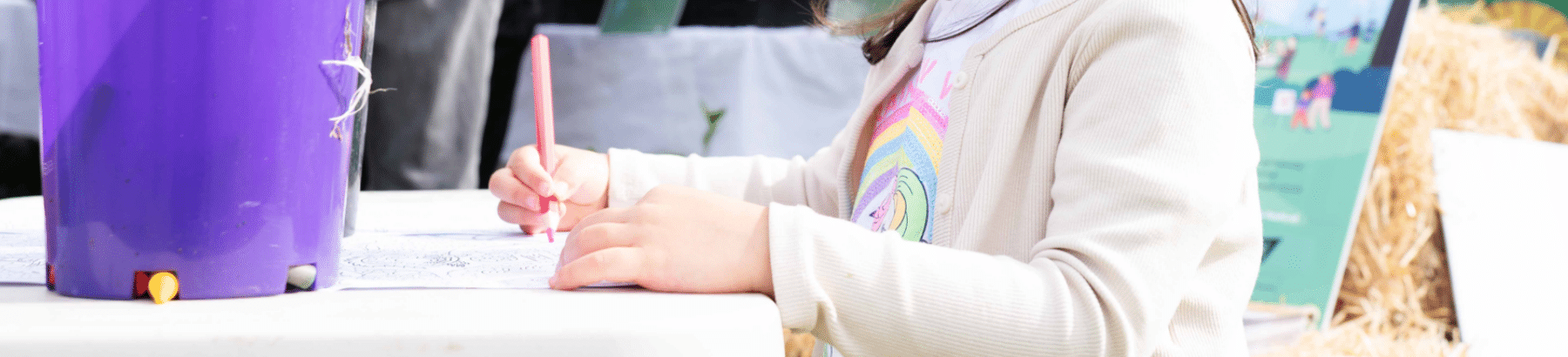 a young person with a pen