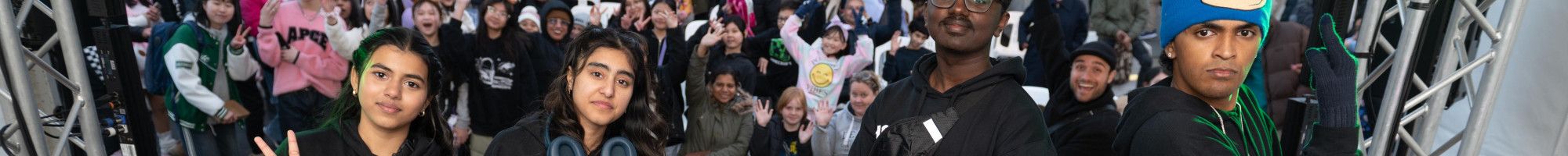 A group of FReeZA young people standing on stage