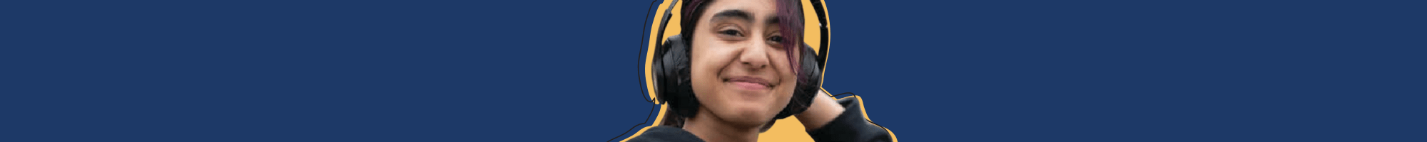 A young person holding a phone smiling