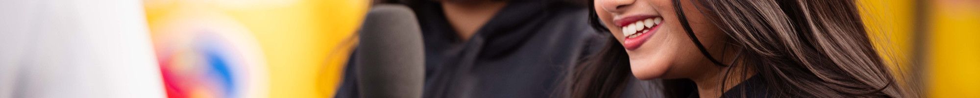 Two young people interviewing someone