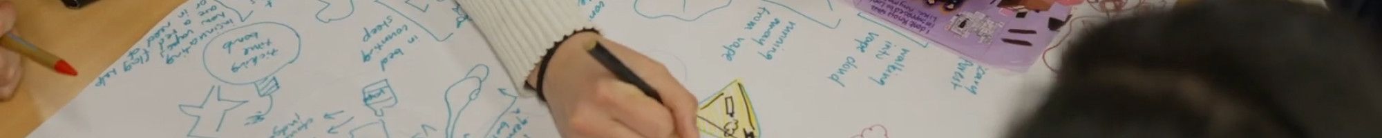 People's hand that are writing on paper